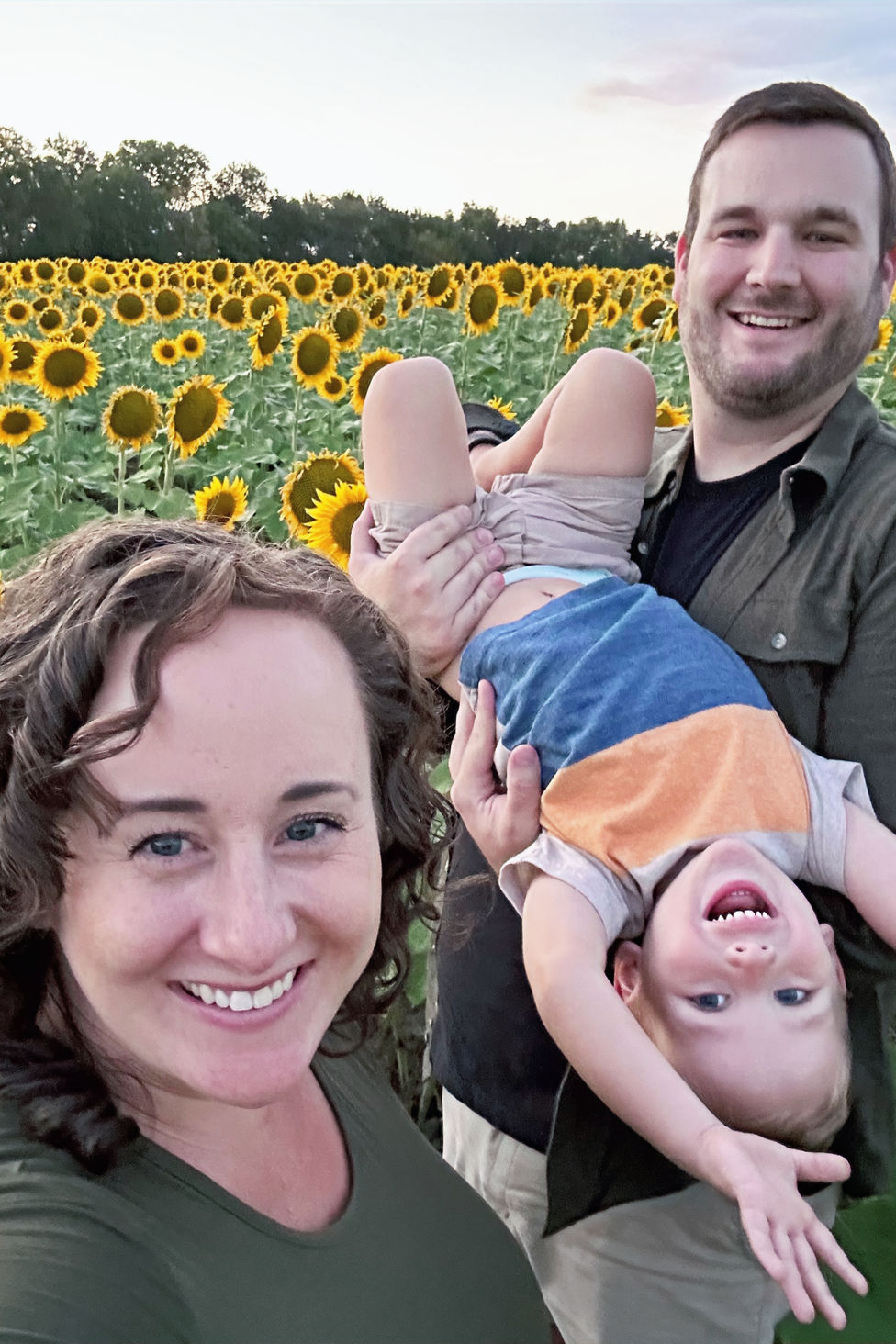 Sharon Carey with her family in a sunflower field